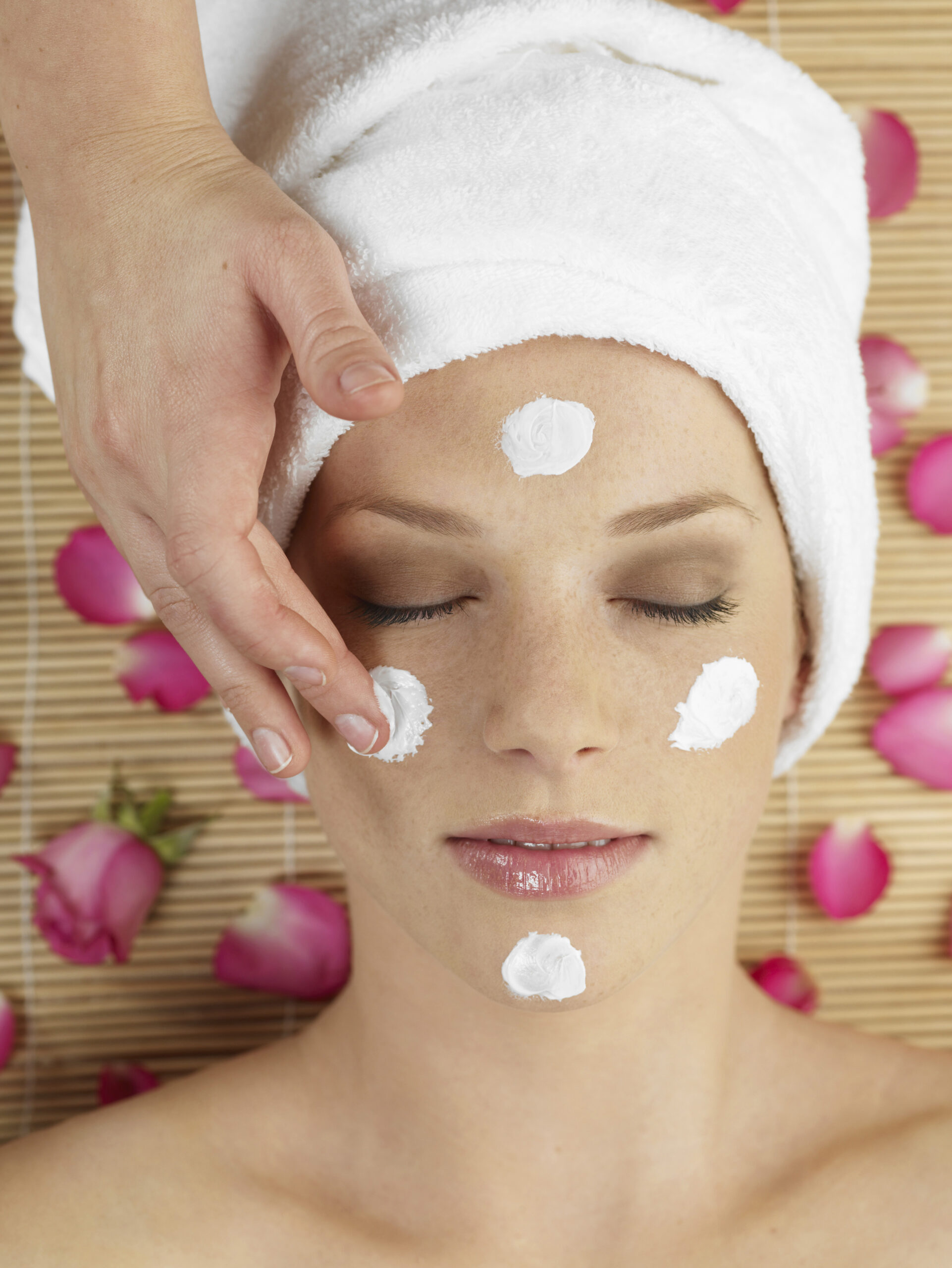 W25, W24, Young woman at spa getting a facial massage, studio